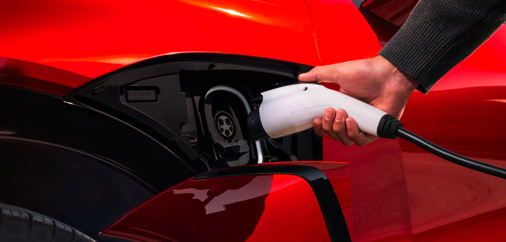 Charging port of red 2026 Chevy Blazer EV for sale in Weatherford, TX