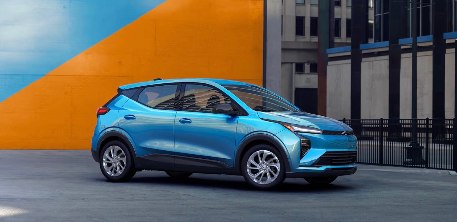 Passenger side exterior of blue 2026 Chevy Bolt in Weatherford, TX