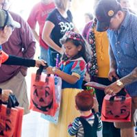 crowd distributing bags to children